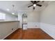 Elegant dining room featuring wainscoting, modern lighting, and gleaming hardwood floors at 4844 W Park Cir # 4844, College Park, GA 30349