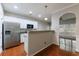 Stylish kitchen featuring stainless steel appliances, breakfast bar, and white cabinetry at 4844 W Park Cir # 4844, College Park, GA 30349