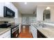 Efficient kitchen with stainless steel appliances, including a sleek oven and granite countertops at 4844 W Park Cir # 4844, College Park, GA 30349