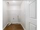 A bright laundry room offers a wire rack and dark wood-look floors at 4844 W Park Cir # 4844, College Park, GA 30349