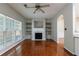 Spacious living room with fireplace, built-in shelving, and gleaming hardwood floors at 4844 W Park Cir # 4844, College Park, GA 30349