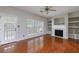 The spacious living room has a fireplace, ceiling fan, and lots of natural light at 4844 W Park Cir # 4844, College Park, GA 30349