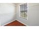 Walk-in closet with hardwood floors, shelving, and a window for natural light at 4844 W Park Cir # 4844, College Park, GA 30349