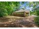 View of the back of the house, with a large yard and covered patio at 55 Fox Chase, Covington, GA 30016