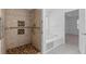 Accessible bathroom featuring a roll-in shower and a soaking tub at 55 Fox Chase, Covington, GA 30016
