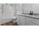 Modern bathroom featuring granite countertops, updated fixtures, and a shower-tub combo at 55 Fox Chase, Covington, GA 30016