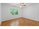 Bedroom features hardwood floors, a ceiling fan, and ample natural light at 55 Fox Chase, Covington, GA 30016