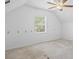 Attic bonus room with carpeted floors, a ceiling fan, and natural light at 55 Fox Chase, Covington, GA 30016