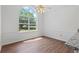 Bright breakfast area with hardwood floors, large window, and granite countertop at 55 Fox Chase, Covington, GA 30016