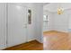 Elegant foyer with hardwood floors, stylish lighting, and a glimpse into the living area at 55 Fox Chase, Covington, GA 30016