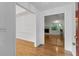 Inviting foyer with gleaming hardwood floors leading to a living area at 55 Fox Chase, Covington, GA 30016