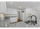 Modern kitchen featuring granite countertops, stainless steel appliances, and bright lighting at 55 Fox Chase, Covington, GA 30016