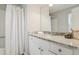 A bathroom with updated vanity, mirror, and shower/tub combo at 107 Woodberry Ct, Woodstock, GA 30188