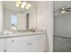 A bathroom with updated vanity, mirror, and light fixtures at 107 Woodberry Ct, Woodstock, GA 30188