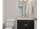 A modern bathroom with updated vanity and light fixtures at 107 Woodberry Ct, Woodstock, GA 30188