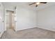 A standard bedroom with carpet flooring and a ceiling fan at 107 Woodberry Ct, Woodstock, GA 30188