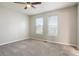 Spacious bedroom with two windows and neutral carpet at 107 Woodberry Ct, Woodstock, GA 30188