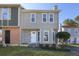 Charming two-story home with light grey siding, white trim, and a well-manicured front yard at 107 Woodberry Ct, Woodstock, GA 30188