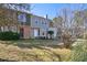 Charming two-story home with light grey siding, brick accents, and a well-manicured front yard at 107 Woodberry Ct, Woodstock, GA 30188