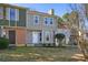 Charming two-story home with light grey siding, brick accents, and a well-manicured front yard at 107 Woodberry Ct, Woodstock, GA 30188