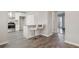 A modern kitchen with granite countertops and seating for two at the bar at 107 Woodberry Ct, Woodstock, GA 30188