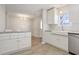 Modern kitchen featuring white cabinets, stainless steel appliances, granite countertops and stainless steel sink at 107 Woodberry Ct, Woodstock, GA 30188