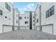 Townhome rear featuring private garages and a modern aesthetic at 1954 8Th St, Chamblee, GA 30341