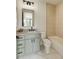 A bathroom featuring a light-green vanity and tile wall at 1954 8Th St, Chamblee, GA 30341