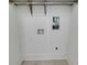 Empty closet features simple shelving and connections for a washer-dryer at 1954 8Th St, Chamblee, GA 30341