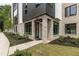 Modern brick building featuring large windows, professional landscaping, and a welcoming entrance with a decorative wreath at 1954 8Th St, Chamblee, GA 30341