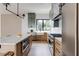 Stylish kitchen featuring a marble island, stainless steel appliances, and a farmhouse sink at 1954 8Th St, Chamblee, GA 30341