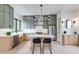 Contemporary kitchen featuring a marble island, green cabinetry, and stainless steel appliances at 1954 8Th St, Chamblee, GA 30341