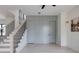 Bright and open living area with custom storage cabinetry and staircase at 1954 8Th St, Chamblee, GA 30341