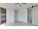 Serene main bedroom features a closet and an en suite bathroom with a sliding barn door entrance at 1954 8Th St, Chamblee, GA 30341