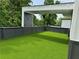 Bright rooftop terrace featuring artificial turf and a covered area with recessed lighting at 1954 8Th St, Chamblee, GA 30341