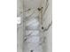 Spa-like shower featuring elegant marble tiles, a built-in bench, and modern fixtures at 1954 8Th St, Chamblee, GA 30341