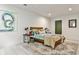Cozy bedroom featuring a comfortable bed, modern decor, and a patterned area rug at 2568 Laurelwood Rd, Atlanta, GA 30360