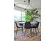 Elegant dining room featuring a round table with stylish chairs and a contemporary light fixture at 2568 Laurelwood Rd, Atlanta, GA 30360