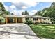 Charming single-story home featuring a covered carport, brick facade, and well-maintained landscaping at 2568 Laurelwood Rd, Atlanta, GA 30360