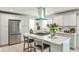 Modern kitchen with stainless steel appliances, white cabinets, and a center island with seating at 2568 Laurelwood Rd, Atlanta, GA 30360