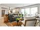 Bright and airy living room featuring a modern sofa, stylish rug, and sliding glass doors at 2568 Laurelwood Rd, Atlanta, GA 30360