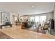 Open concept living room features an inviting seating area, a modern kitchen, and natural light at 2568 Laurelwood Rd, Atlanta, GA 30360