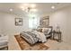 Calm main bedroom featuring an inviting bed with side tables and a contemporary light fixture at 2568 Laurelwood Rd, Atlanta, GA 30360
