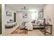 Cozy main bedroom featuring modern decor, a bench, natural light, and stylish furniture at 2568 Laurelwood Rd, Atlanta, GA 30360