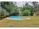 Beautiful kidney shaped pool and freshly installed sod in a private backyard at 2568 Laurelwood Rd, Atlanta, GA 30360