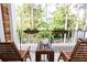 Relaxing balcony featuring wooden furniture, lush greenery, and tranquil surroundings at 2610 Oglethorpe Ne Cir, Brookhaven, GA 30319
