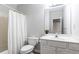 Neutral-toned bathroom featuring a shower/tub combo, a vanity, and a toilet at 2610 Oglethorpe Ne Cir, Brookhaven, GA 30319