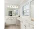 Bright bathroom with double vanity, lots of natural light, and modern fixtures at 2610 Oglethorpe Ne Cir, Brookhaven, GA 30319