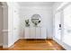 Entryway features light-filled space, hardwood floors, a modern cabinet and stylish decor at 2610 Oglethorpe Ne Cir, Brookhaven, GA 30319