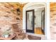 Welcoming front entry features a wooden chair, front door with glass, and brick accents at 2610 Oglethorpe Ne Cir, Brookhaven, GA 30319